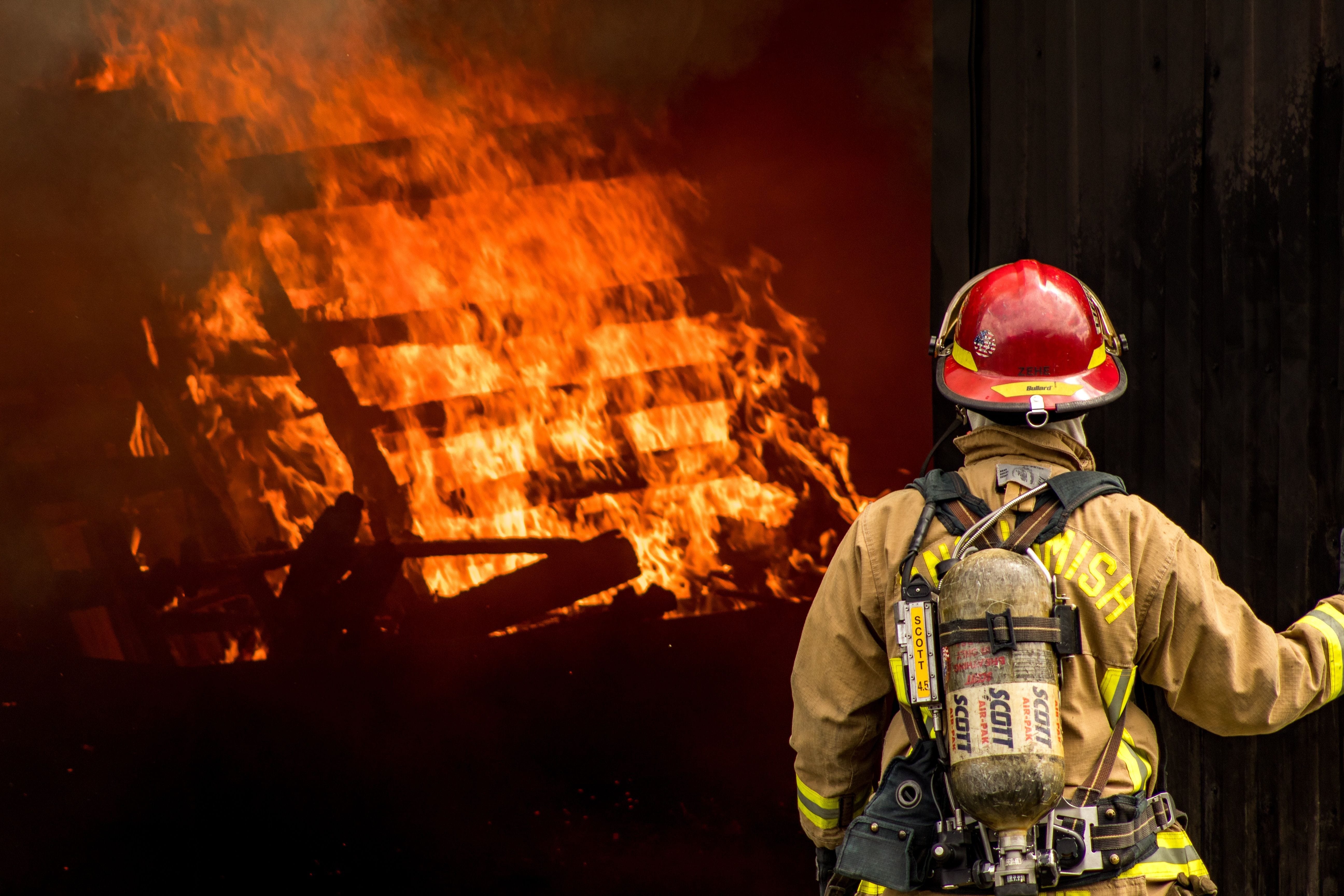 Picture is of first responders at a fire. Fire Alarms can alert occupants and save lives.
